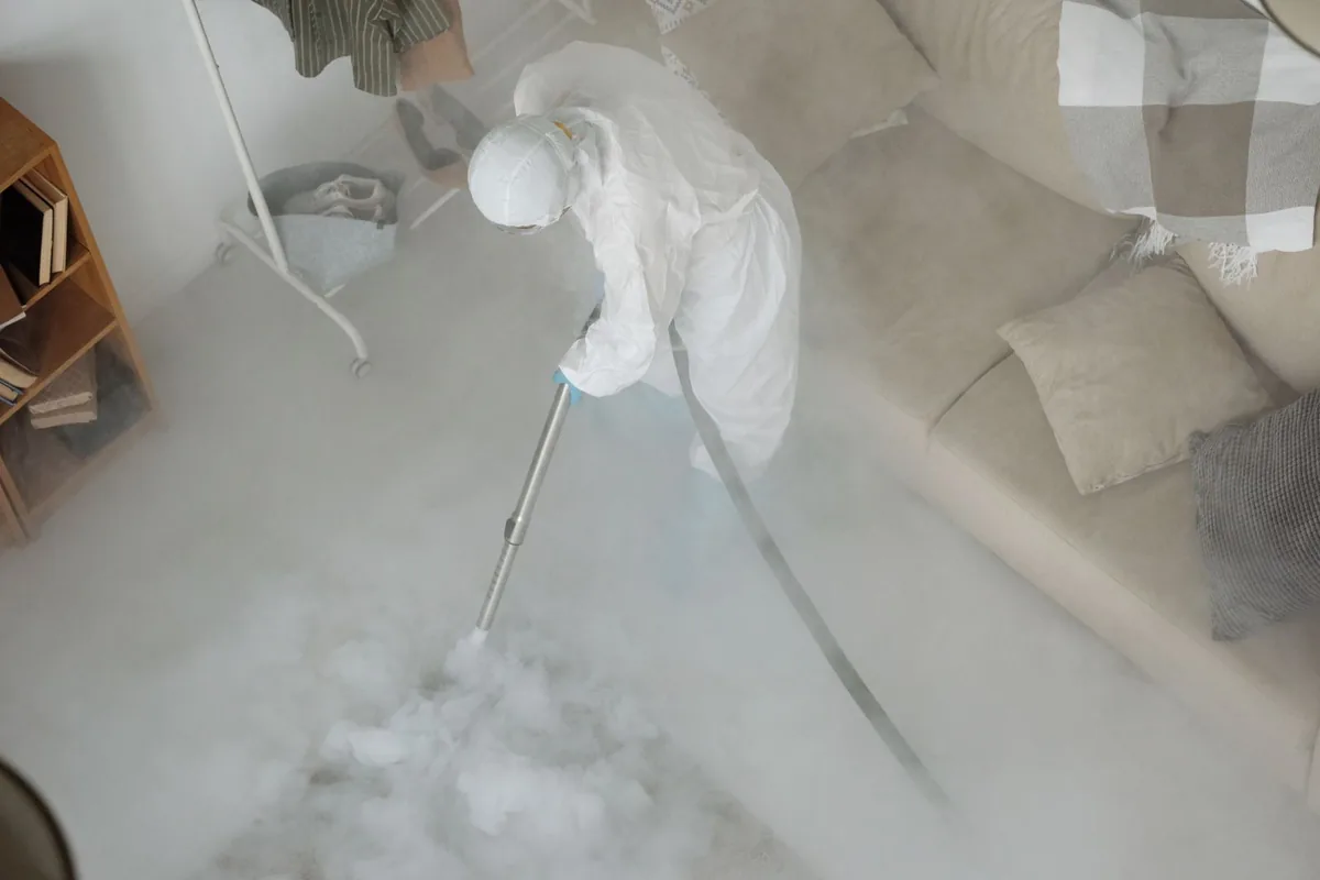 Biohazard cleanup technician in protective equipment, Ross, CA